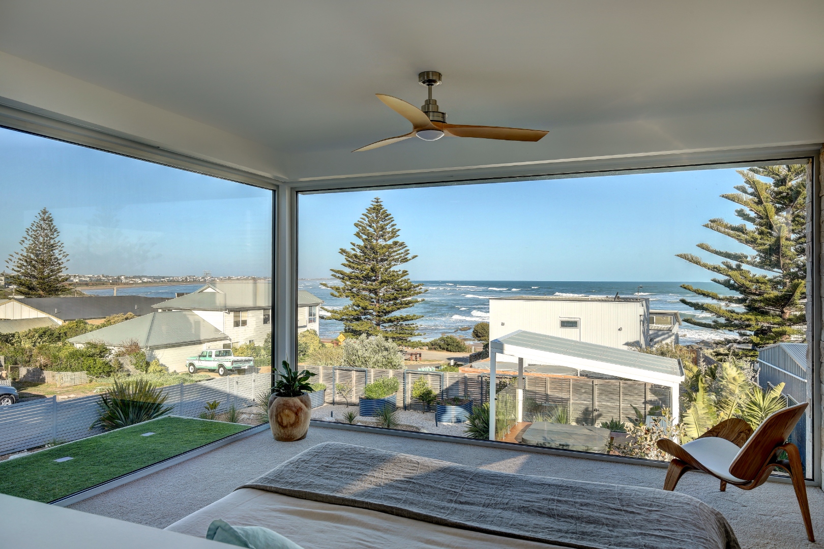 Middleton SA — bedroom with wraparound ocean-view glazing