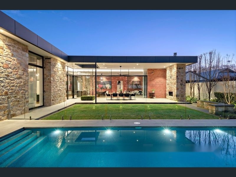 Norwood 18 Project — twilight exterior with pool and stone cladding