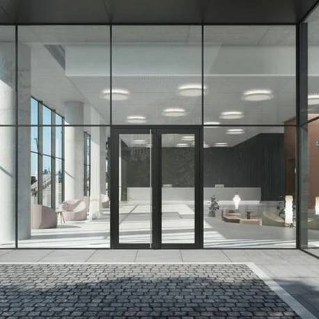 Commercial entrance lobby with double Schüco AD UP 90 glazed doors