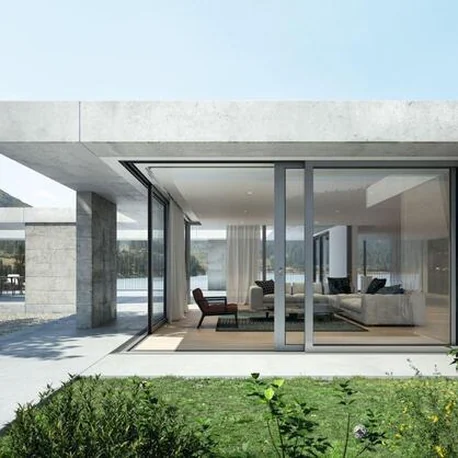 Single-storey house with Schüco lift-and-slide doors opening to a lawn