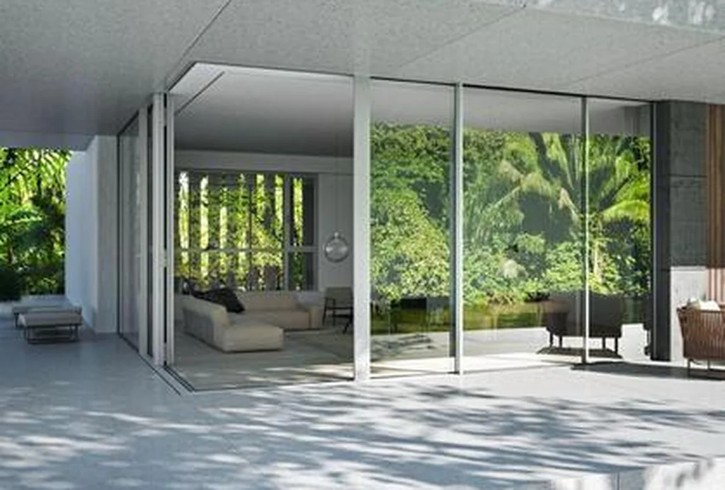 Interior opening through Schüco ASS 39 PD.NI sliding panels onto a garden terrace