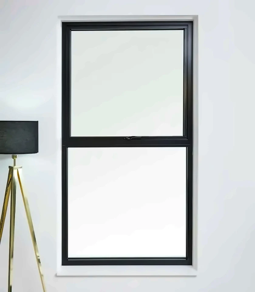 Two-light outward-opening Schüco AWS 80 SC aluminium casement window in a dark finish, installed in a plain interior wall