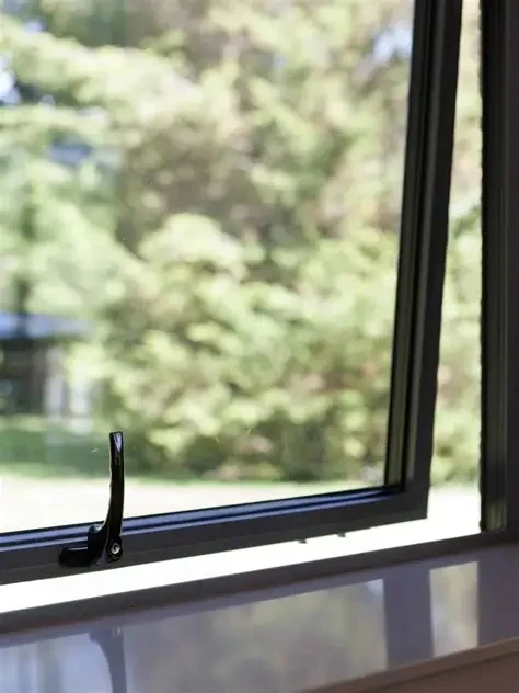 Interior view of an AWS 80 SC casement window open on its handle