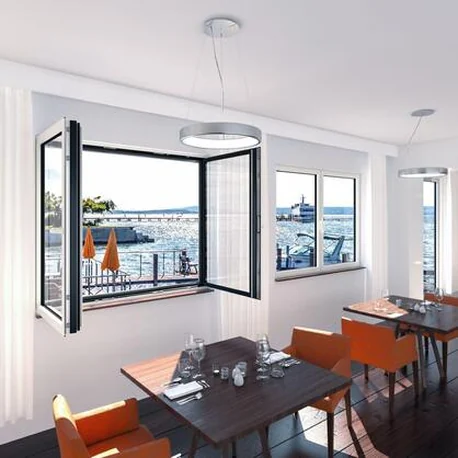 Meeting room with AWS 90.SI+ side-hung windows opened to a harbour view