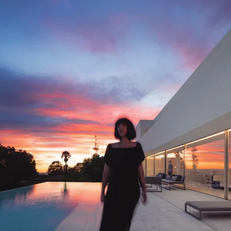 Casa Santa Pola at dusk, seen across the pool through a full-height Sosoares OS minimalist sliding wall