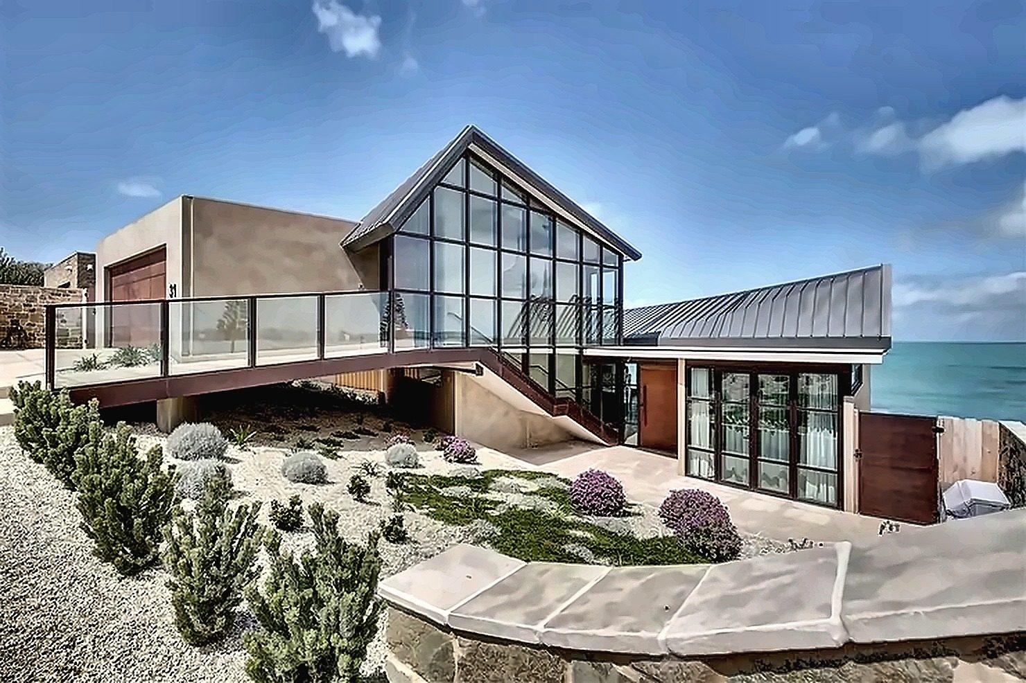 Clifftop residence with full-height glazed gable