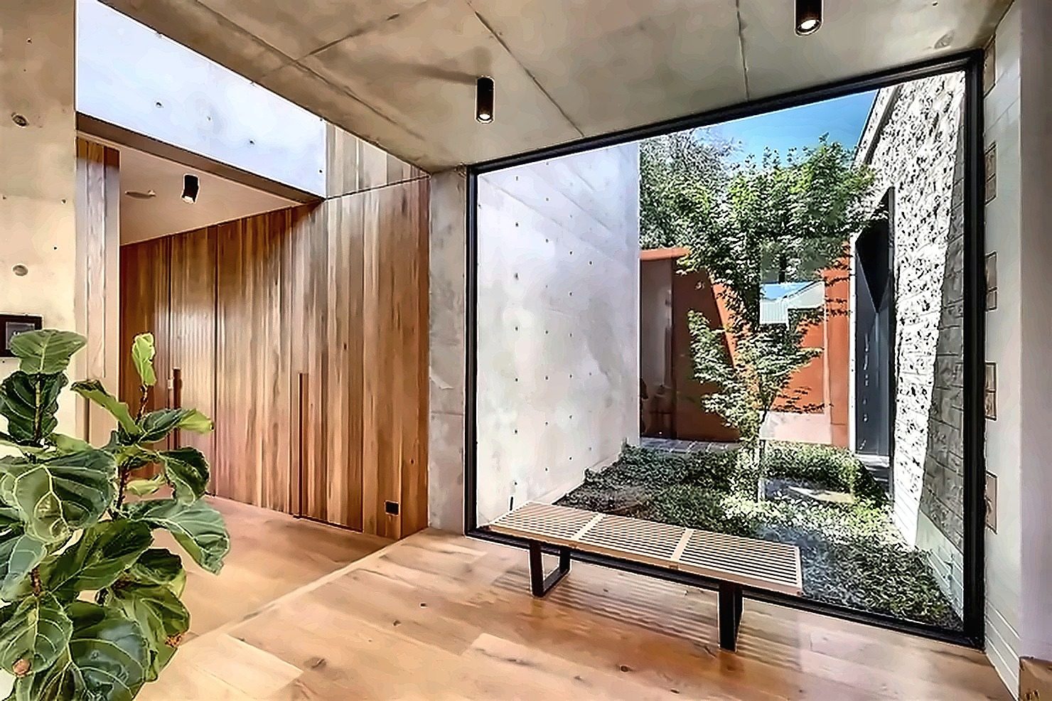 Contemporary home with large fixed glazing and courtyard